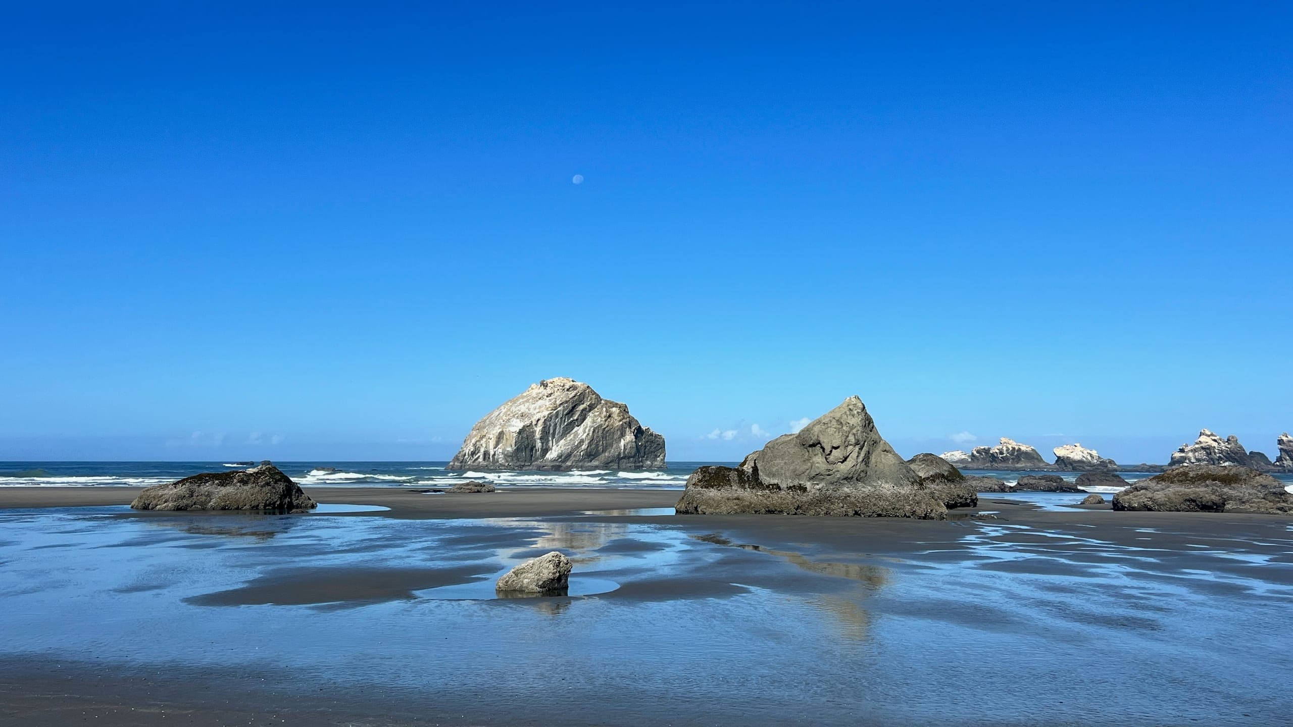 Face Rock, a famous coastal sea stack shaped like a human profile looking toward the sky.