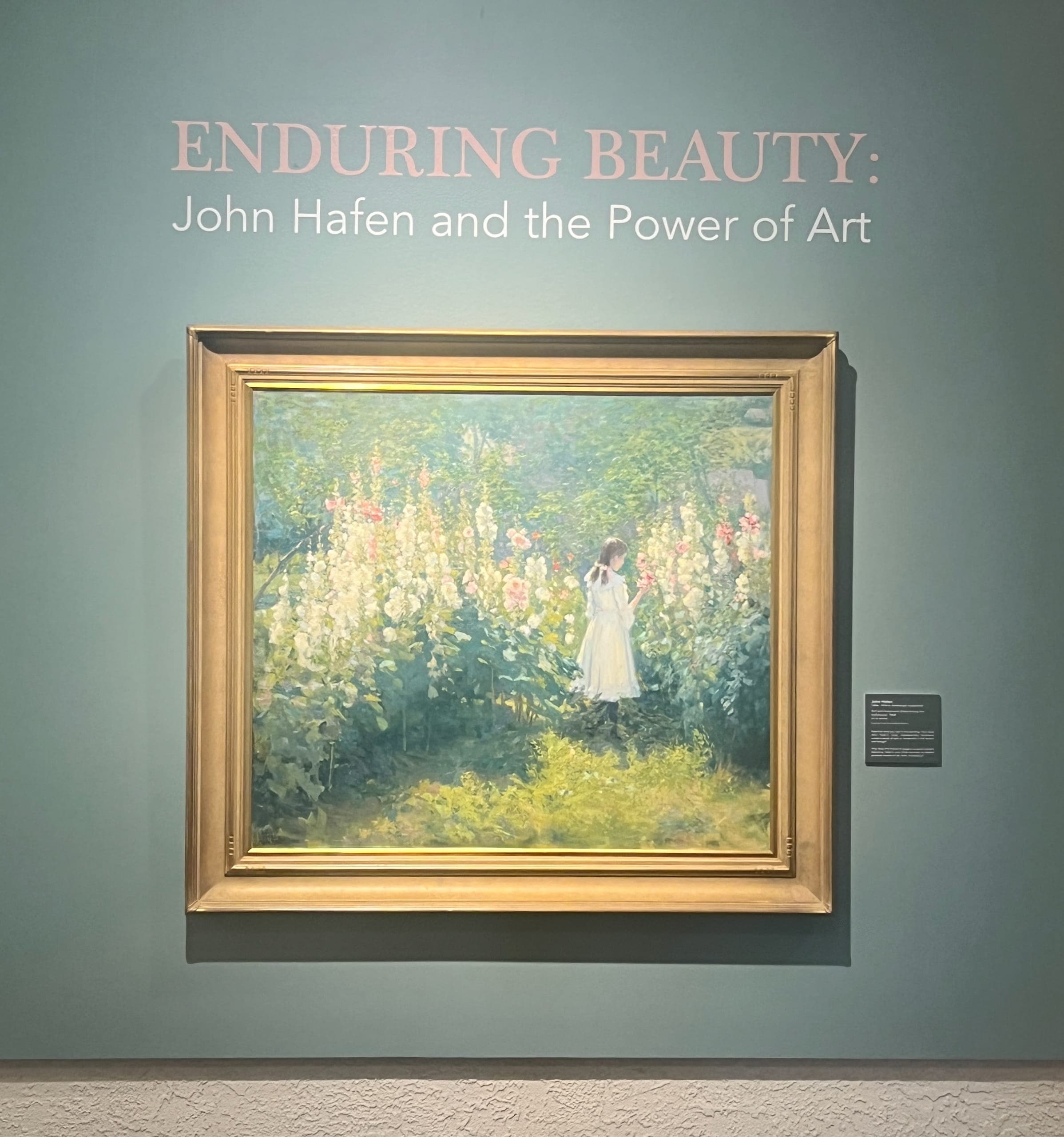 "Girl Among the Hollyhocks" painting by John Hafen