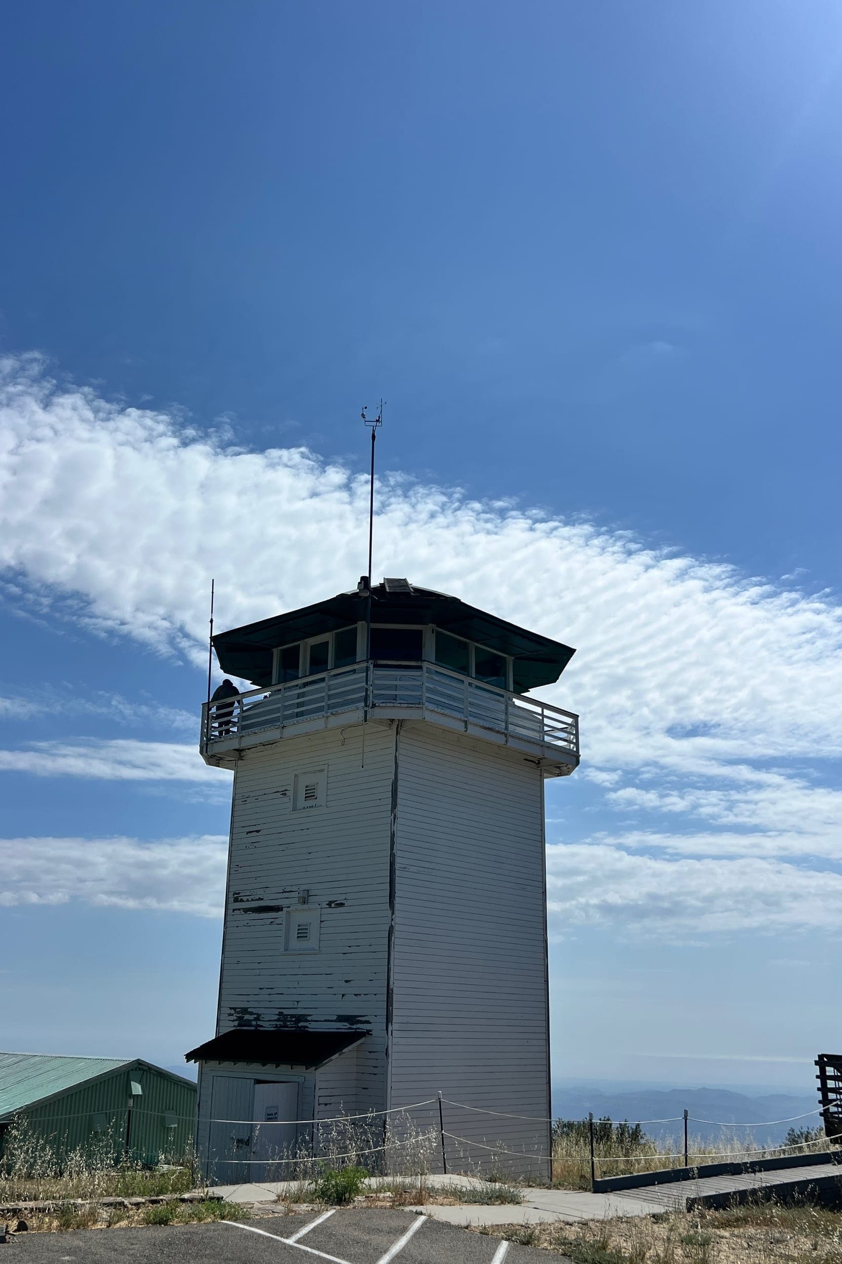 Large white octagonal wooden lookout tower.