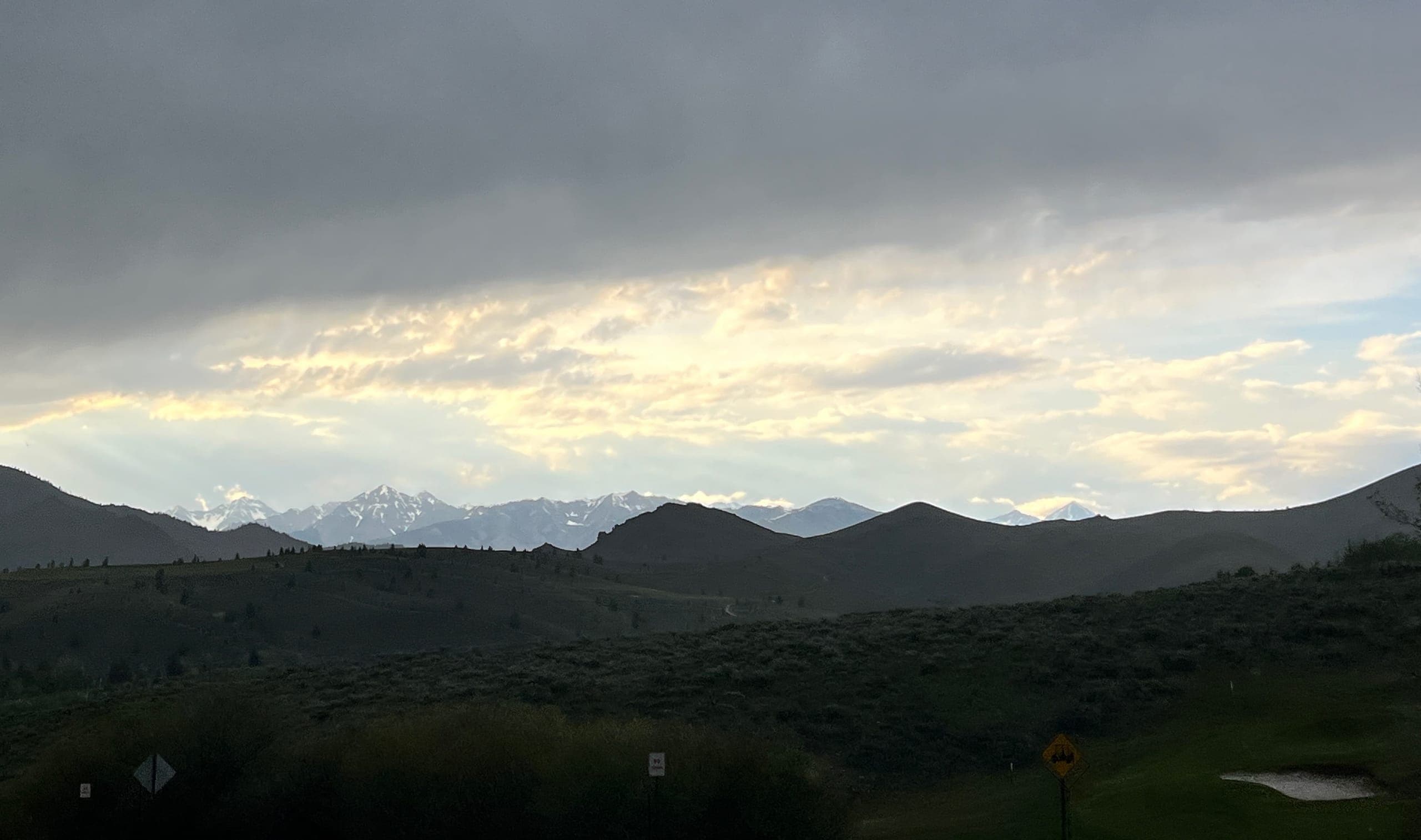 Sun Valley at dusk with distant Sawtooth mountains still sunlit.
