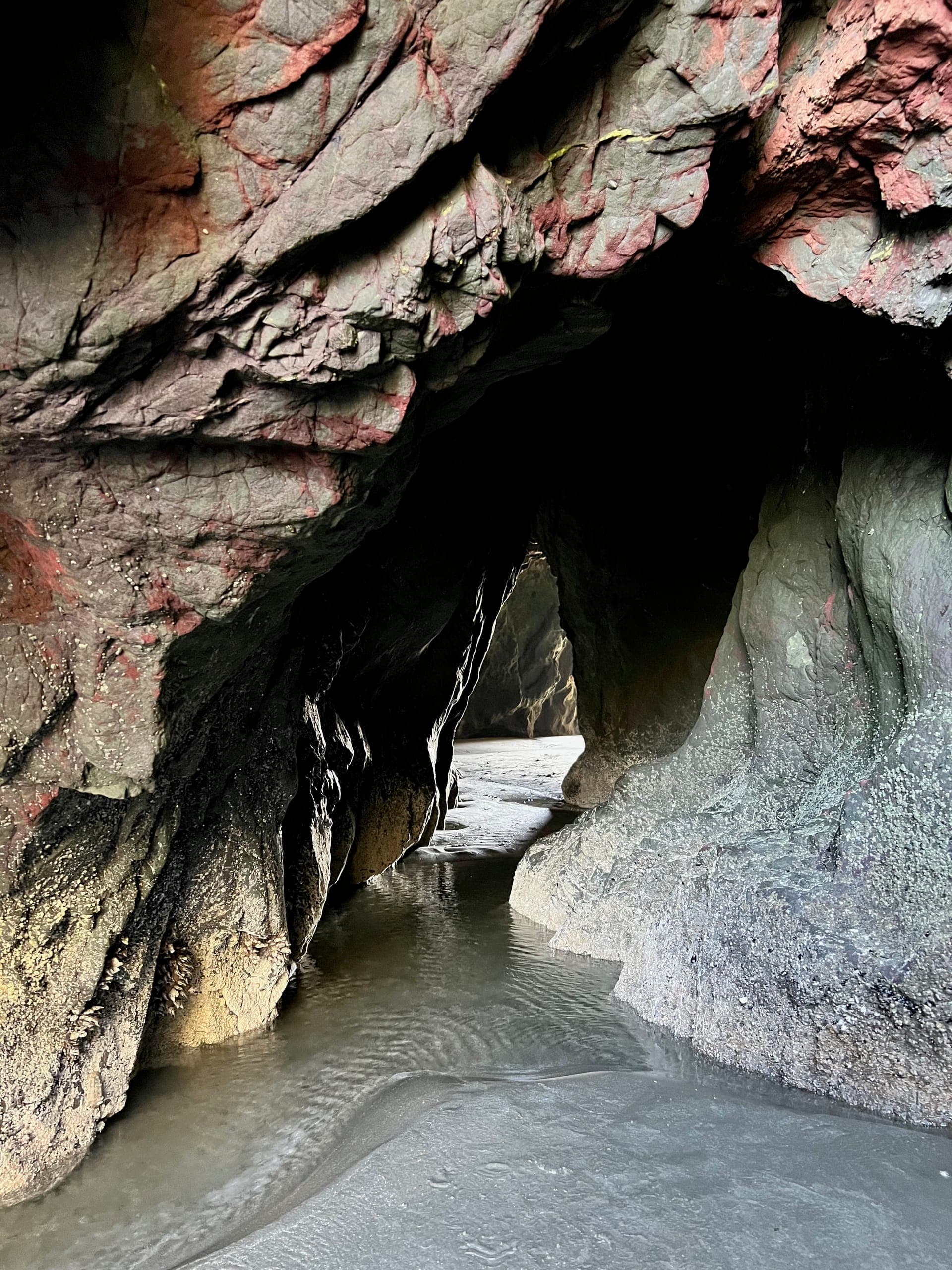 Opening carved through the coastal rocks.