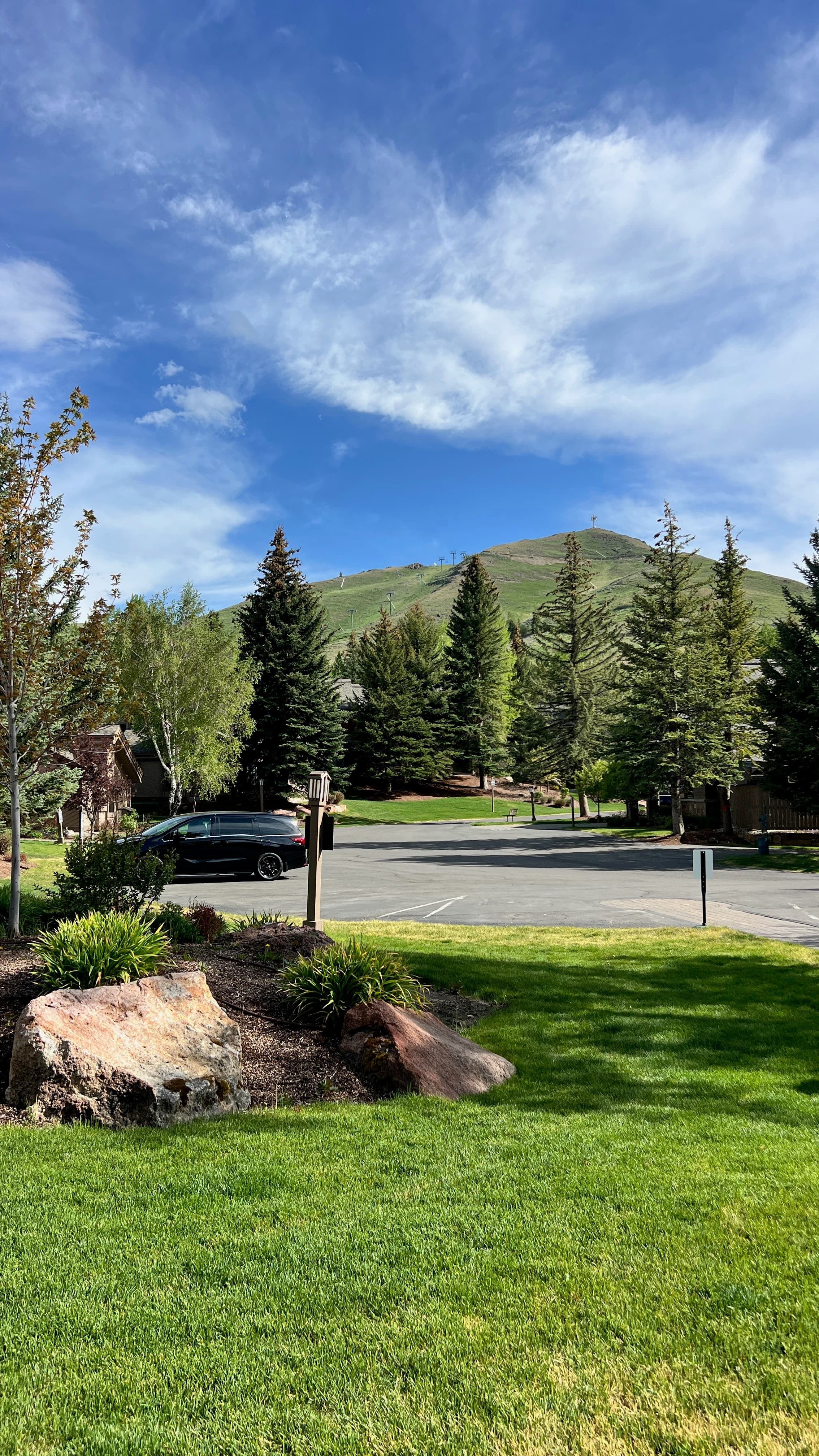 Black Betty minivan in the parking area with Dollar Mountain in the background.