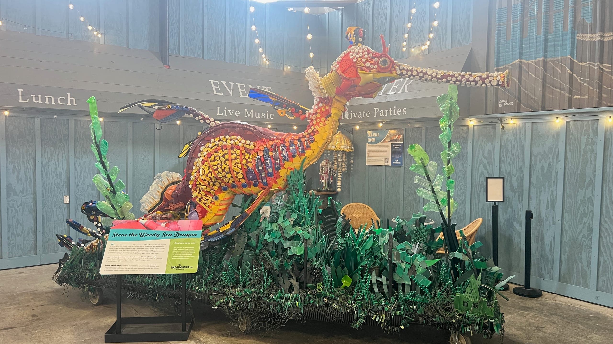 A statue of a Steve the Weedy Sea Dragon made from plastic trash collected on the beach.